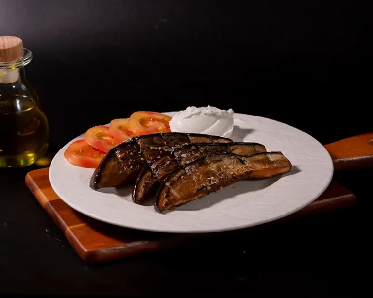 Do you need to salt aubergine or eggplant after roasting? Roasted aubergine with final salt, tomato, olive oil, and cream.