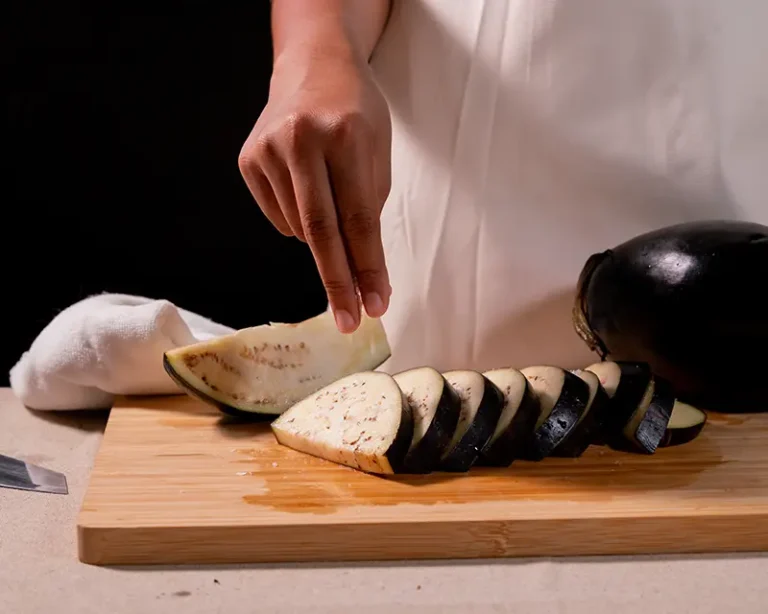 Do you need to salt aubergine before cooking? Salted aubergine slices prepared for better browning and texture.