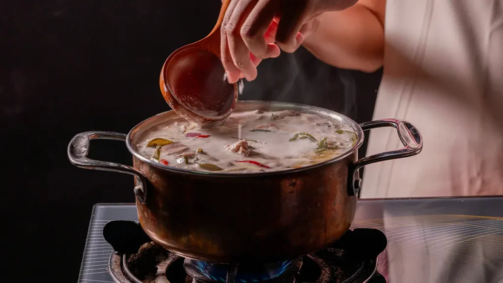 Does salt smell? Salt being added to warm soup as heat carries aroma from the surface.
