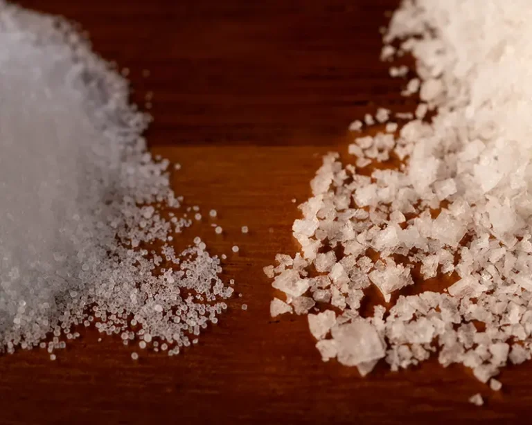 Fine and coarse salt crystals showing differences in size and structure