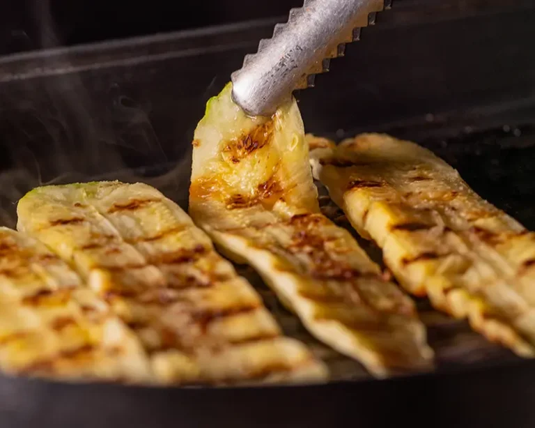 How salt affects flavour by helping surface moisture cook off so grilled courgette browns instead of steaming.