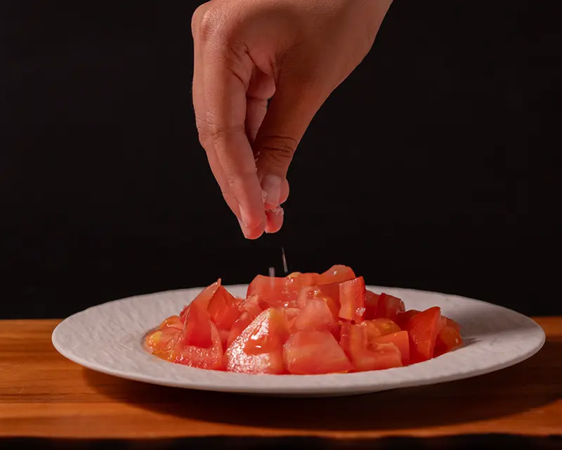 how salt moves through food as salt is added to chopped tomatoes