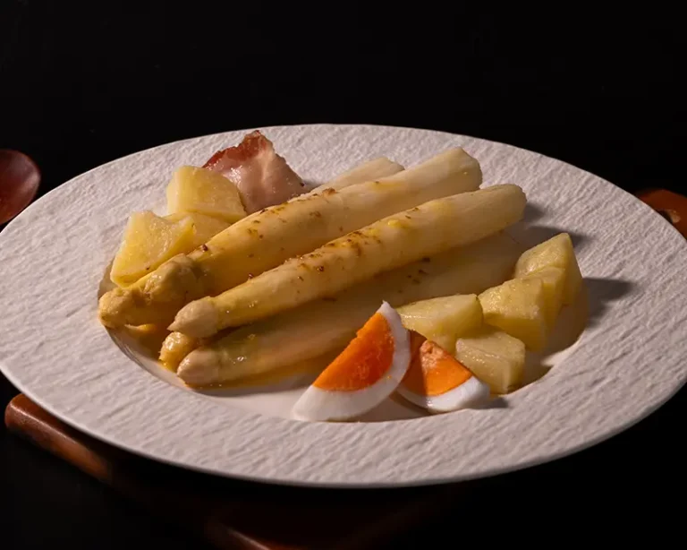 How to salt asparagus with finishing salt, white asparagus, egg, and potatoes