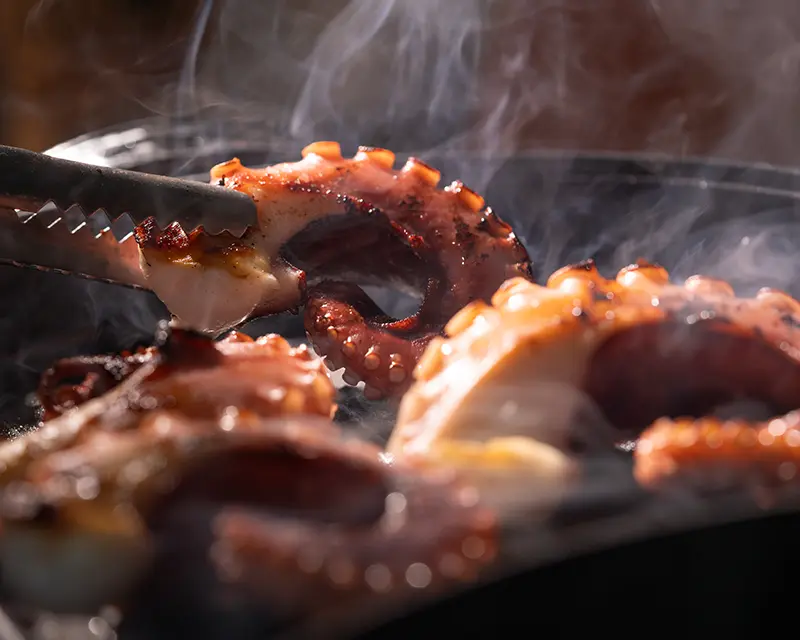 How to salt grilled octopus after searing the edges over high heat
