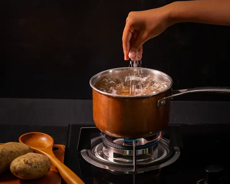 How to salt mashed potatoes by salting the cooking water before mashing.