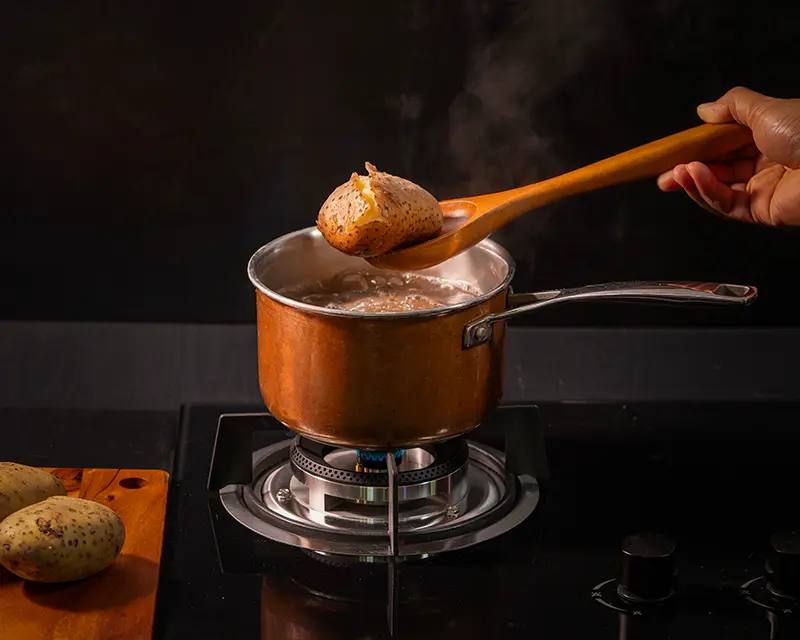 How to season boiled potatoes when cooking skin-on potatoes in salted water.