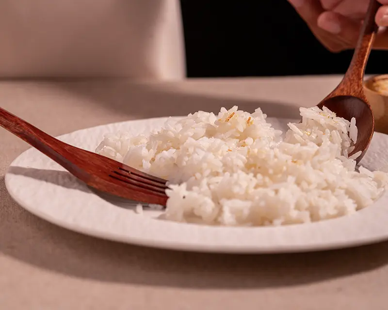 How to season rice with a light pinch of saffron salt on warm white rice.