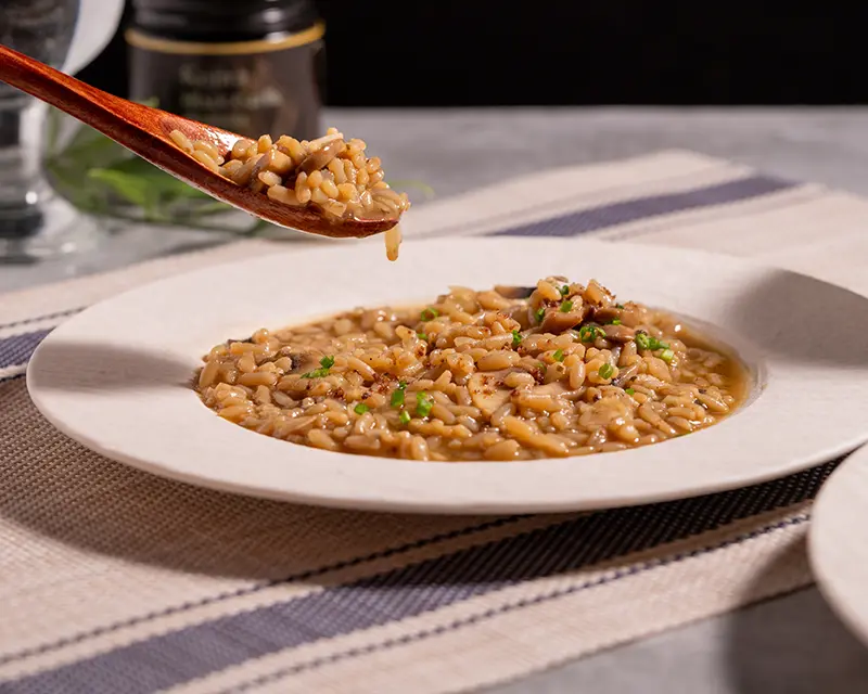 Finished mushroom risotto showing how to season risotto with Kojira Black Garlic Salt