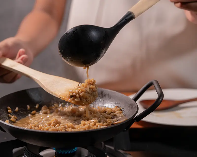 Mantecatura showing how to season risotto after it has come together
