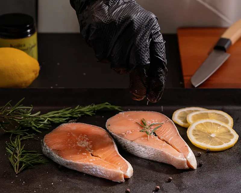 How to season salmon before cooking by salting both cut faces evenly.
