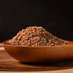Black garlic salt in a wooden bowl