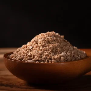 Preserved lemon mineral salt with visible citrus peel in wooden bowl