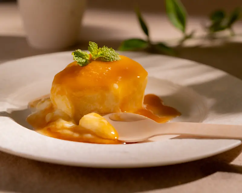 Salt on desserts with cream caramel dessert and mint