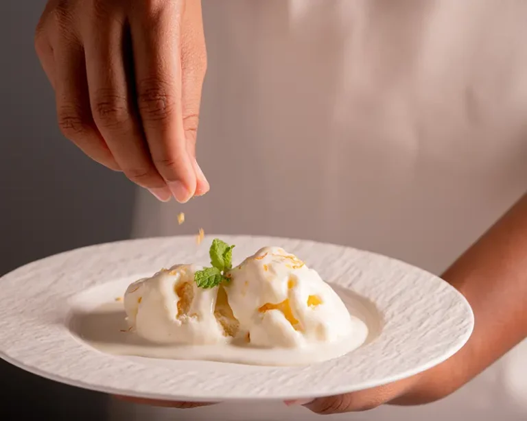 Salt on desserts added as a final surface pinch over vanilla ice cream