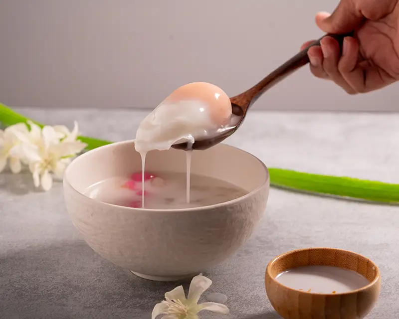 Thai bua loy with sweet poached egg in coconut milk for salt on desserts