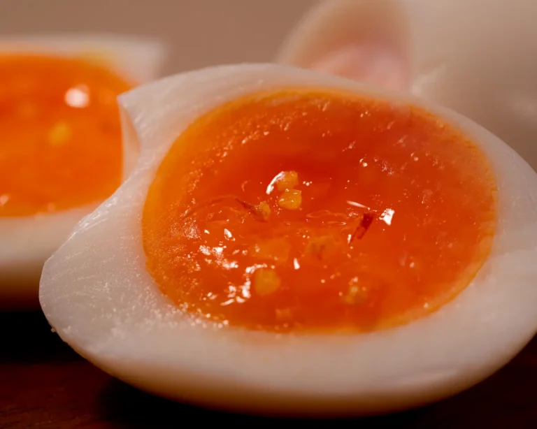 Soft-boiled egg with saffron salt crystals on a runny yolk