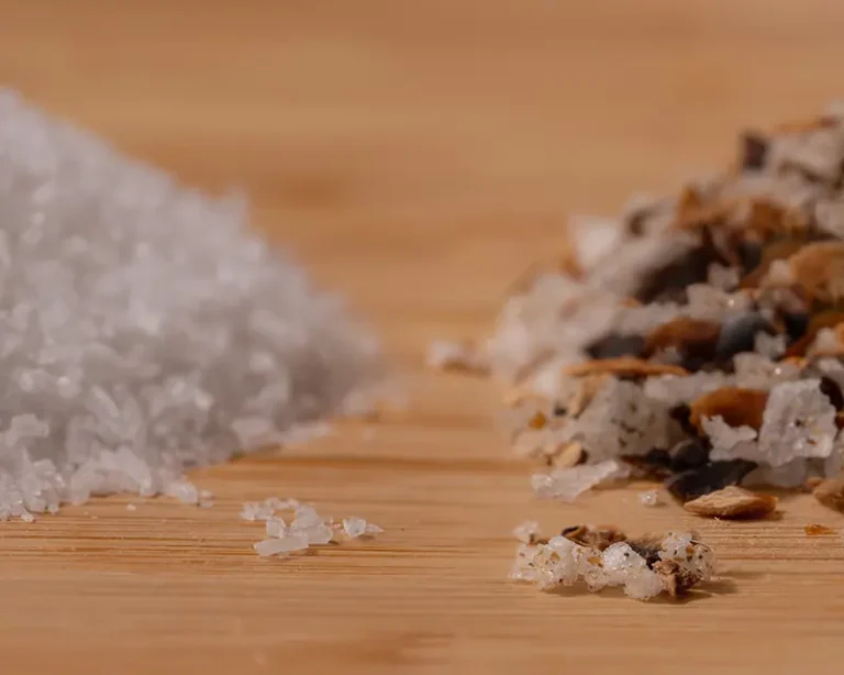 Umami salt vs MSG comparison showing plain salt crystals beside umami salt made with whole ingredients.