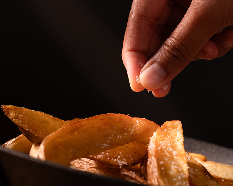 when to salt fries while hot
