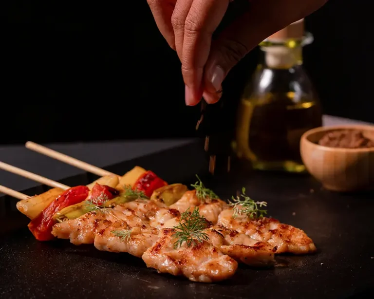 Chicken skewers in a guide about when to salt meat, showing quick-cooking chicken being finished after cooking.