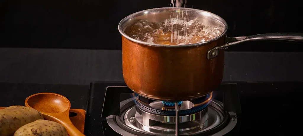 When to salt potatoes by adding salt to the cooking water while potatoes boil.