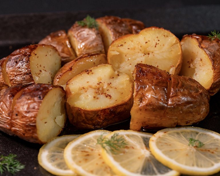 Roast potatoes with lemon and herbs showing how fat, herbs, and serving style affect when to salt roast potatoes.