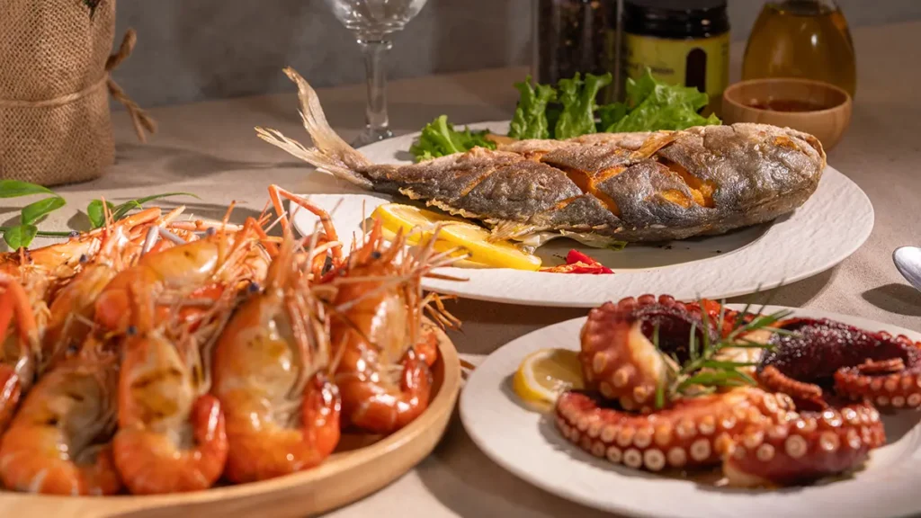When to salt seafood with whole fried fish, grilled prawns and octopus