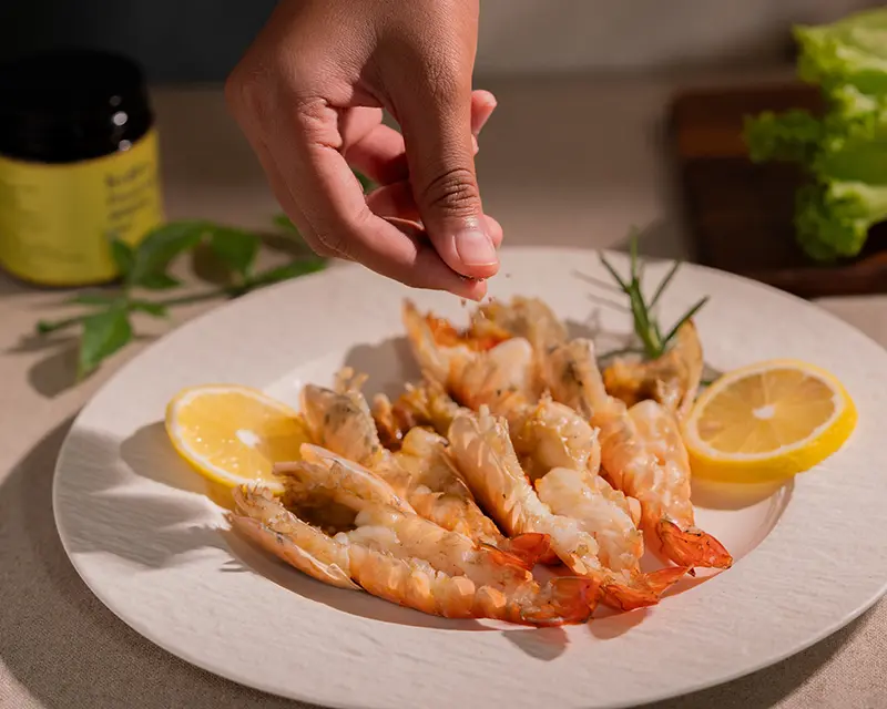 When to salt shrimp: adding finishing salt to hot grilled butterflied tiger prawns