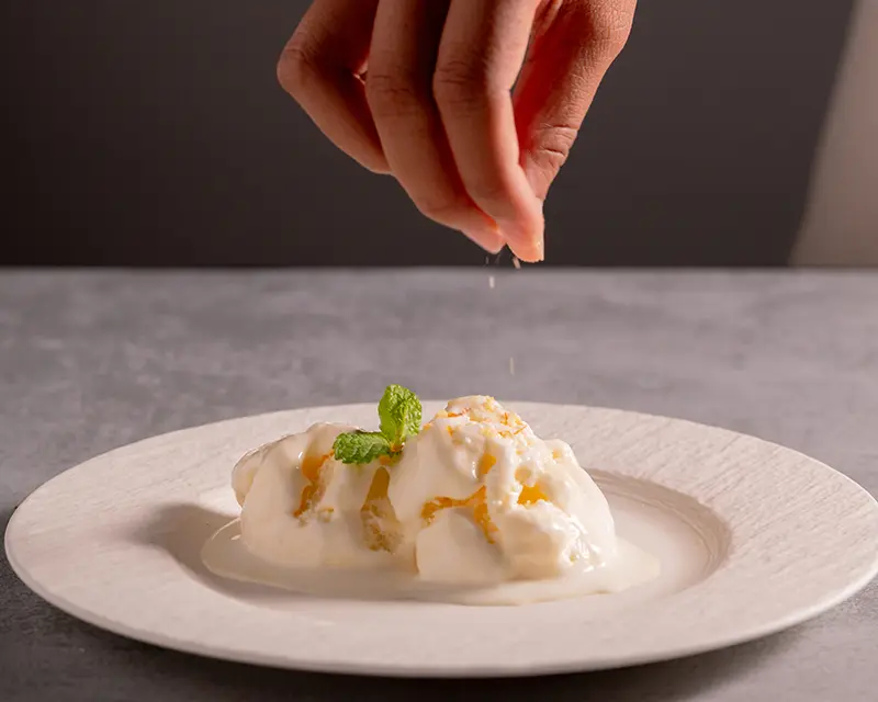 Why salt makes food taste better by adding contrast to a creamy dessert with finishing salt.
